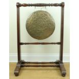 A late Victorian bronze dinner gong and mahogany stand, 63 cm x 95 cm high
