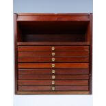 A glazed teak counter-top display cabinet with integral shallow drawers, 37 cm x 30 cm x 39 cm