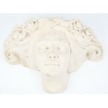 A late 20th / early 21st Century cast resin wall pocket, modelled as a maiden's head with roses in
