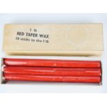 A carton of eight red sealing wax sticks