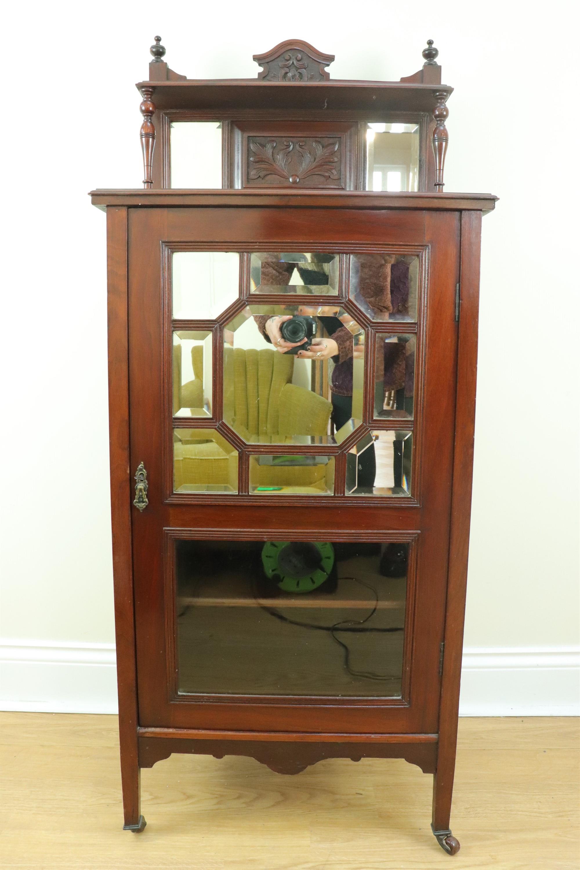 A late 19th / early 20th Century carved, glazed and mirror-fronted music or similar cabinet, 56 cm x