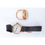 A 1920s lady's 9 ct gold wristwatch, having a Swiss movement, the plain circular case on a black