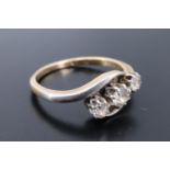 A vintage twist-set three-stone diamond ring, the stones of approx 0.5 ct aggregate weight