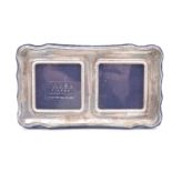 A modern silver faced double photograph frame, having a plush covered back and stay, Sheffield,