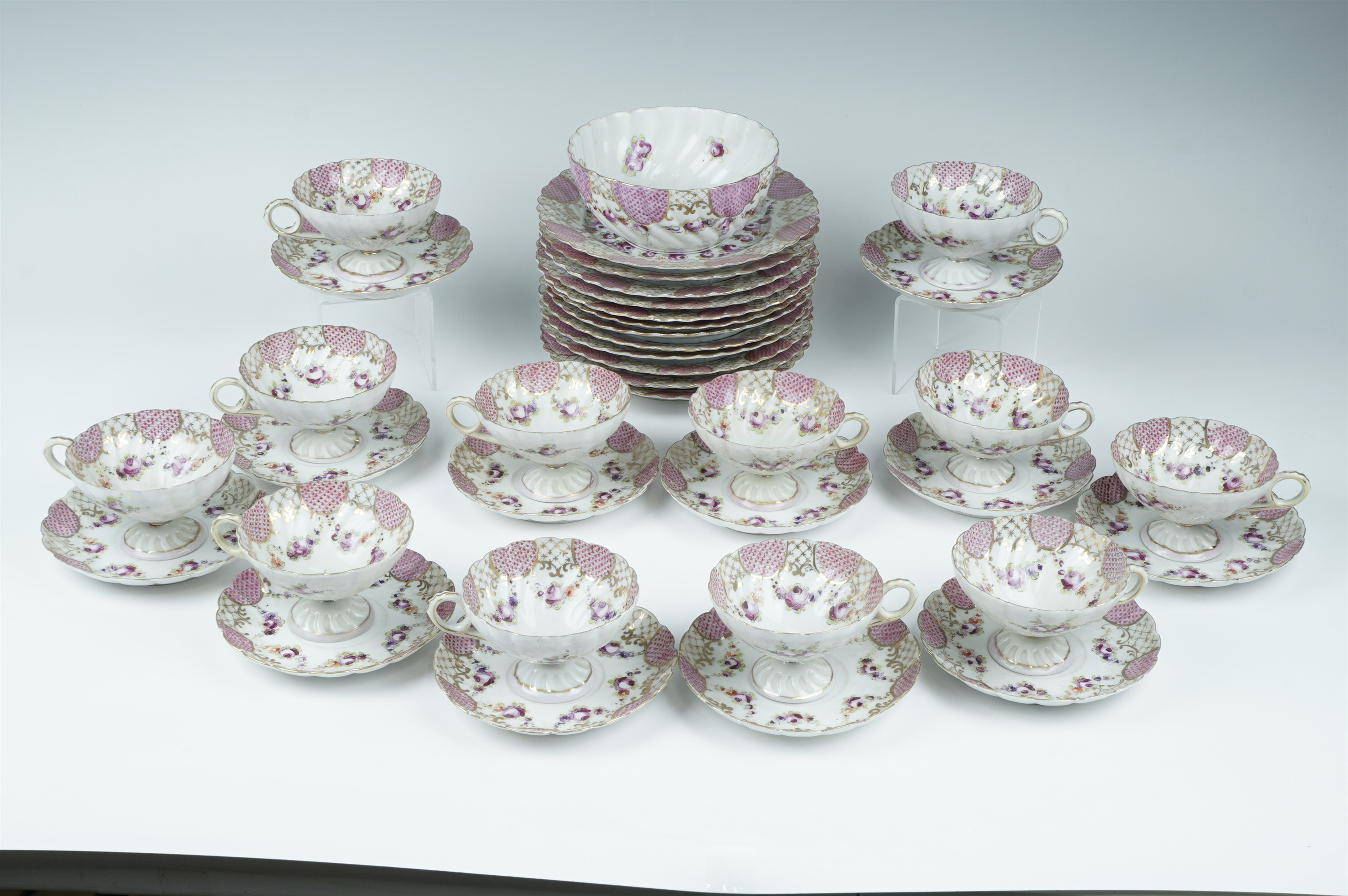 A late 19th/early 20th Century French Sevre influenced porcelain teaset, decorated in patterns of