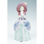 An early 20th Century Staffordshire figurine of a lady wearing a bonnet, 31 cm