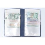 A folder containing a small collection of GB and world banknotes, including an O'Brien One Pound,