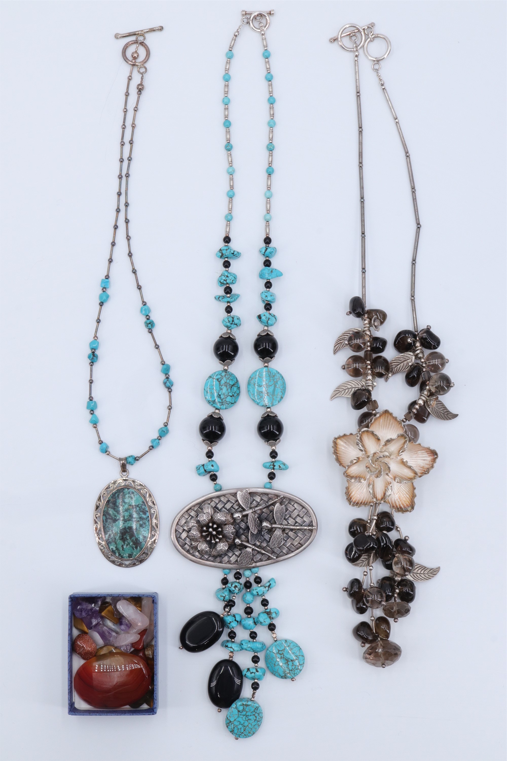 Three late 20th Century silver and semi precious stone necklaces, comprising alternating turquoise