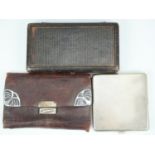 An Edwardian cased sewing kit, a silver mounted leather wallet, Steinhart & Co, Birmingham, 1903,