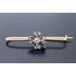 A late 19th / early 20th Century pink sapphire and diamond "lucky" four-leaf clover stock pin, the