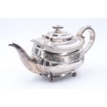 A George III silver teapot, having a square section spout, strap form handle with ivory