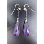 A pair of late 19th / early 20th Century faceted amethyst and yellow metal teardrop ear pendants,