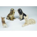 Four Kitsch dog figurines