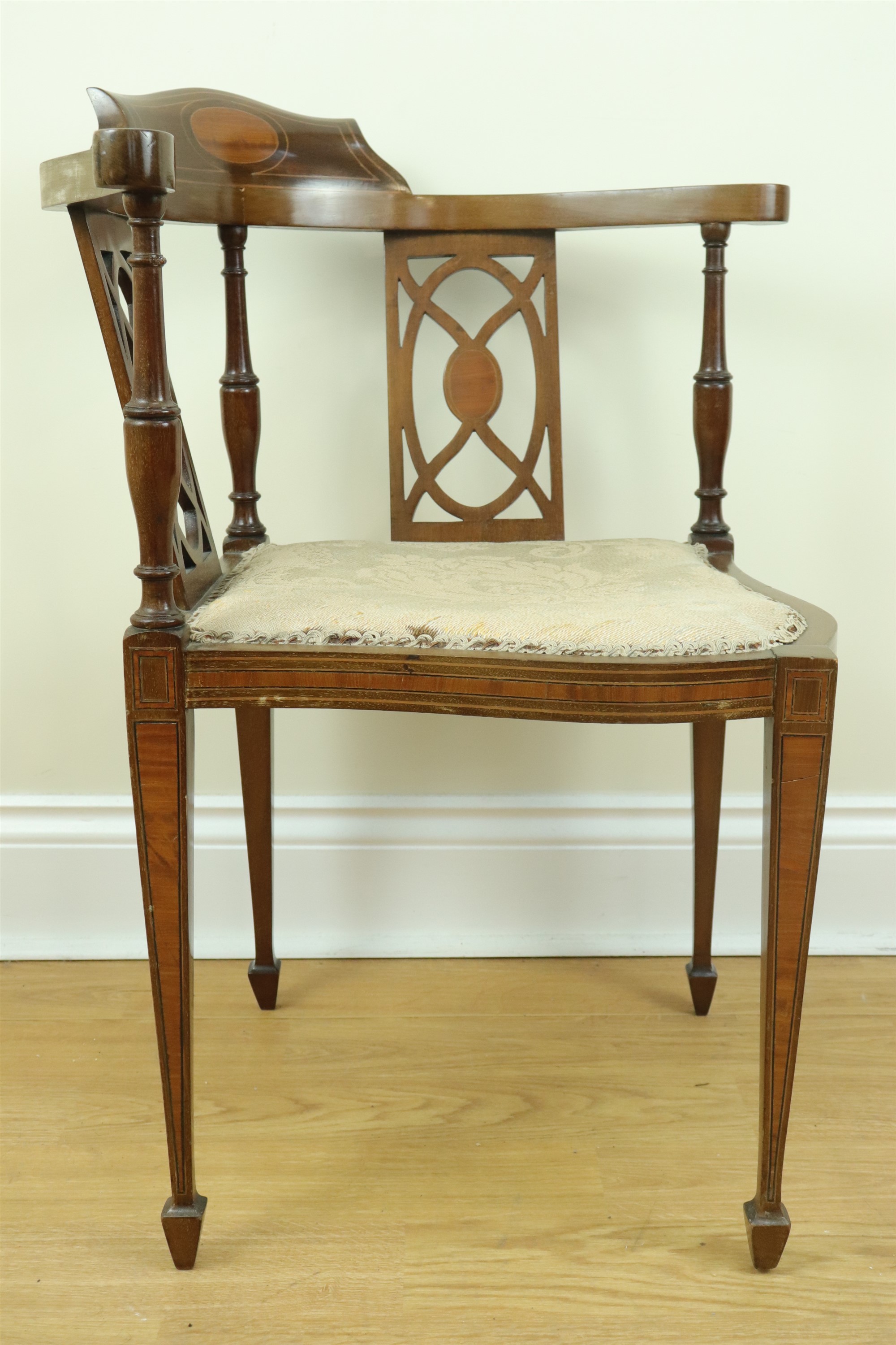 A late 19th / early 20th Century inlaid mahogany corner armchair