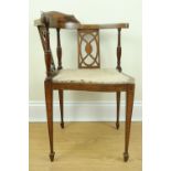 A late 19th / early 20th Century inlaid mahogany corner armchair