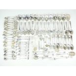 A large quantity of flatware including salt spoons, sugar tongs etc