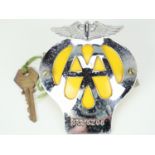 An AA car badge and key