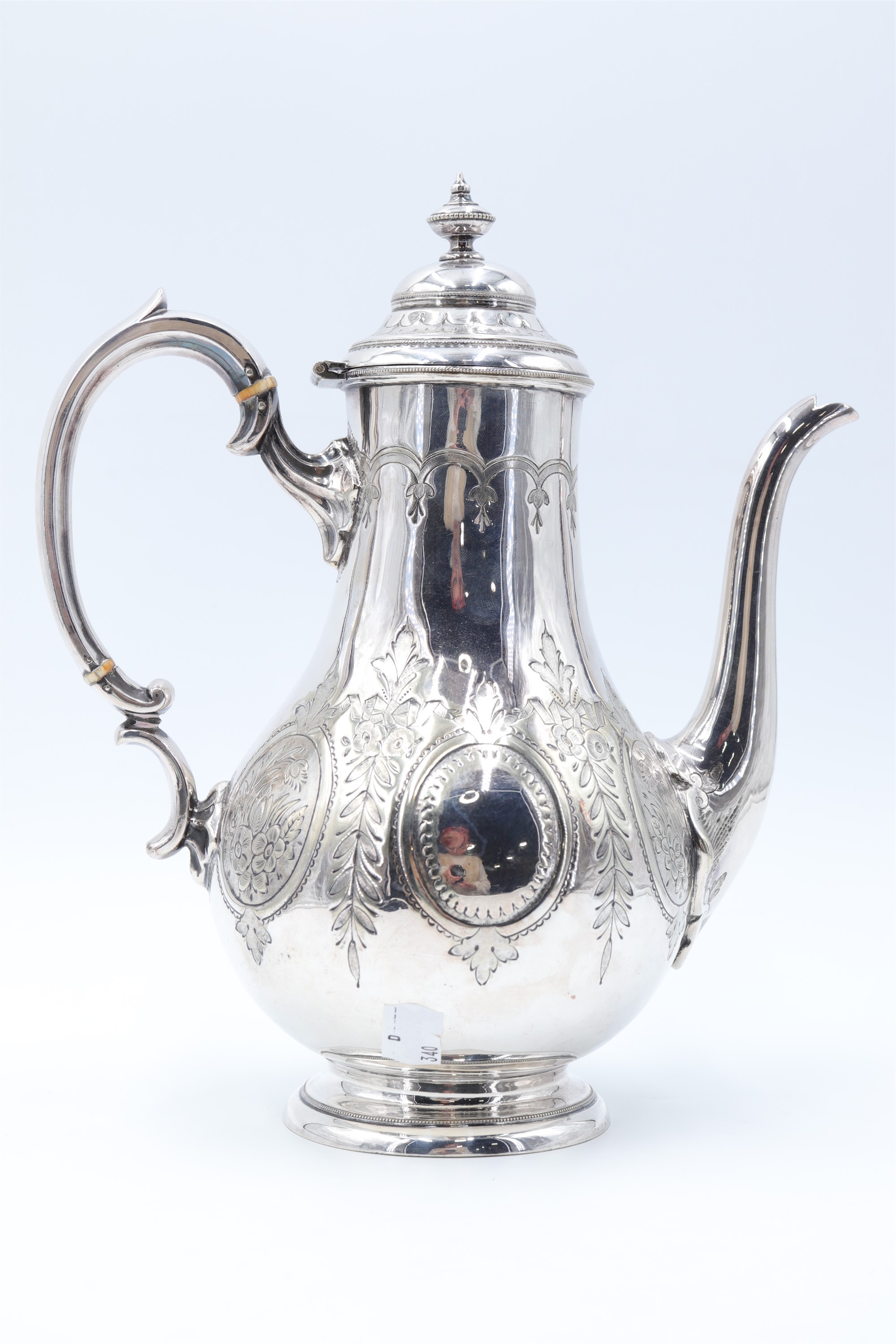 A Victorian electroplated coffee pot by Thomas Prime, of pear shape with chased and engraved