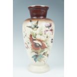 A Victorian hand painted glass vase, decorated in depiction of a swallow among flowers, 41.5 cm