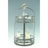 A contemporary wrought metal pendant lantern light fitting, 60 x 30 cm excluding chain