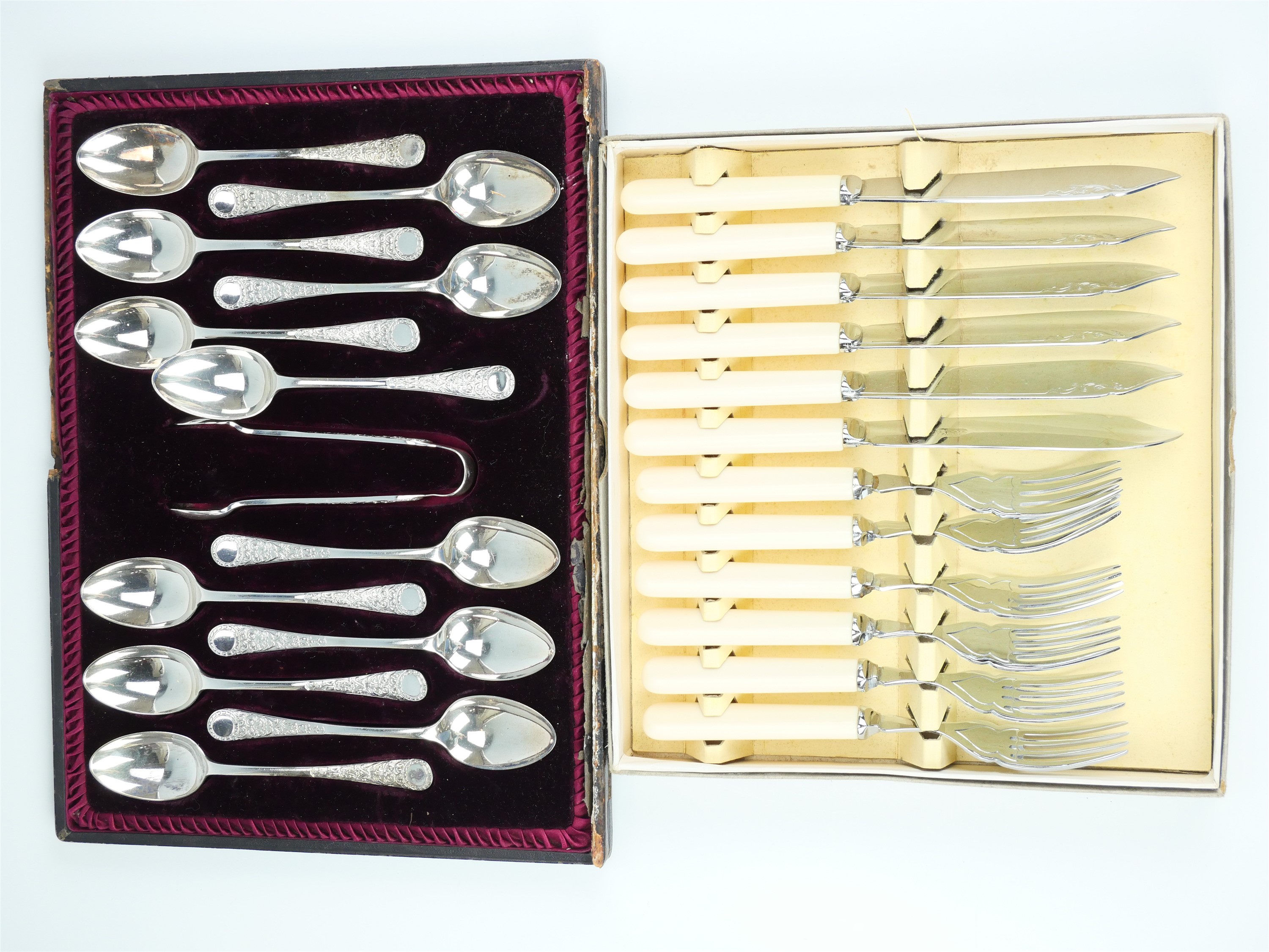 A cased set of twelve Victorian Walker and Hall electroplate tea spoons with sugar tongs, together