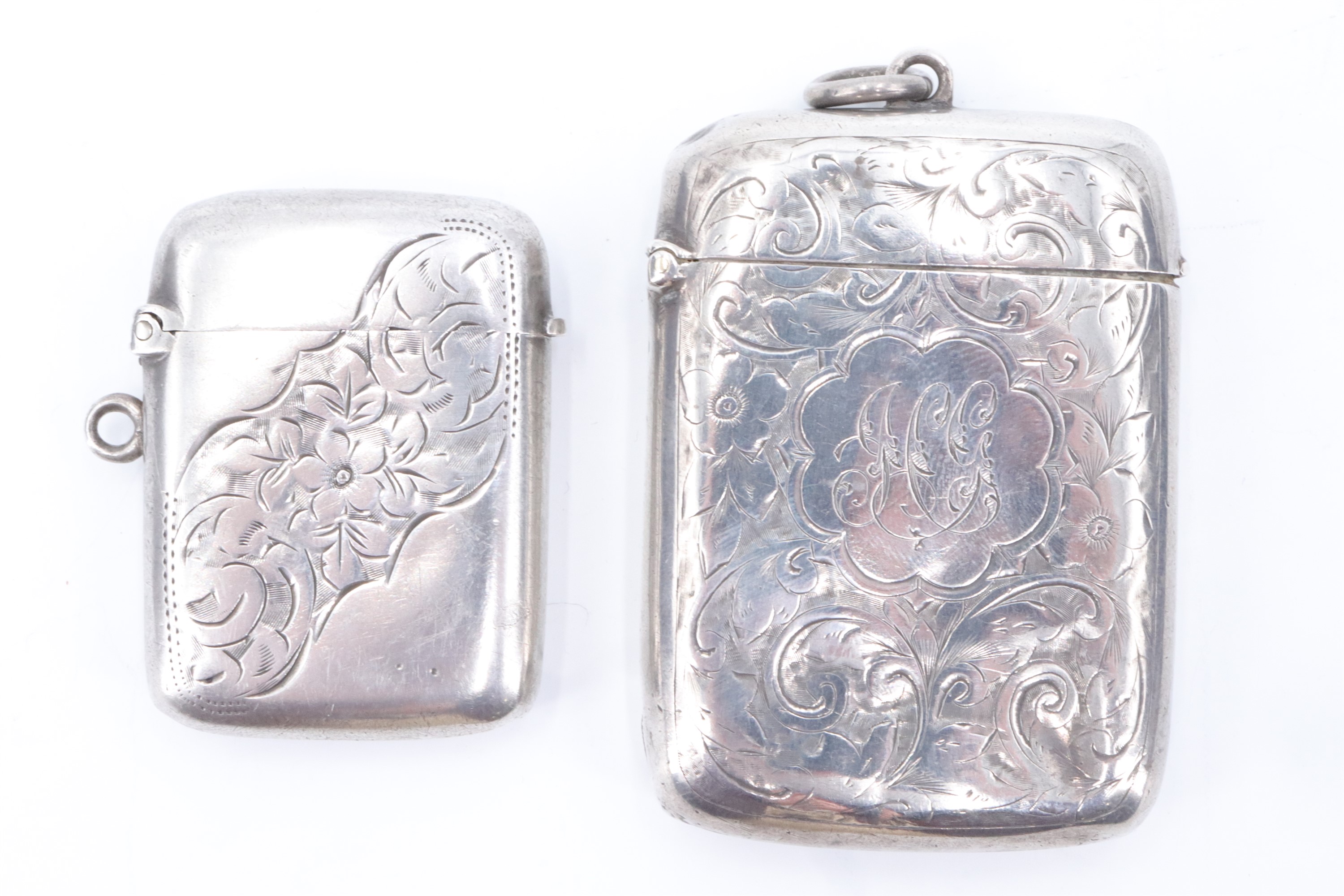 Two late Victorian silver vesta cases, both having engraved floral decoration, Birmingham 1895 and