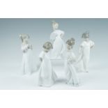 Five Nao figurines, girl with fan, girl with puppy etc, tallest 22 cm