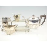 A three piece electroplate teaset together with bottle holder and miniature trolley, 27 cm x 18 cm x