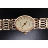 A lady's Accurist "Gold" 9 ct gold dress wristwatch, having a quartz movement and integral