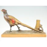 An early 20th Century Austrian cold painted spelter table cigar lighter, modelled as a cock pheasant