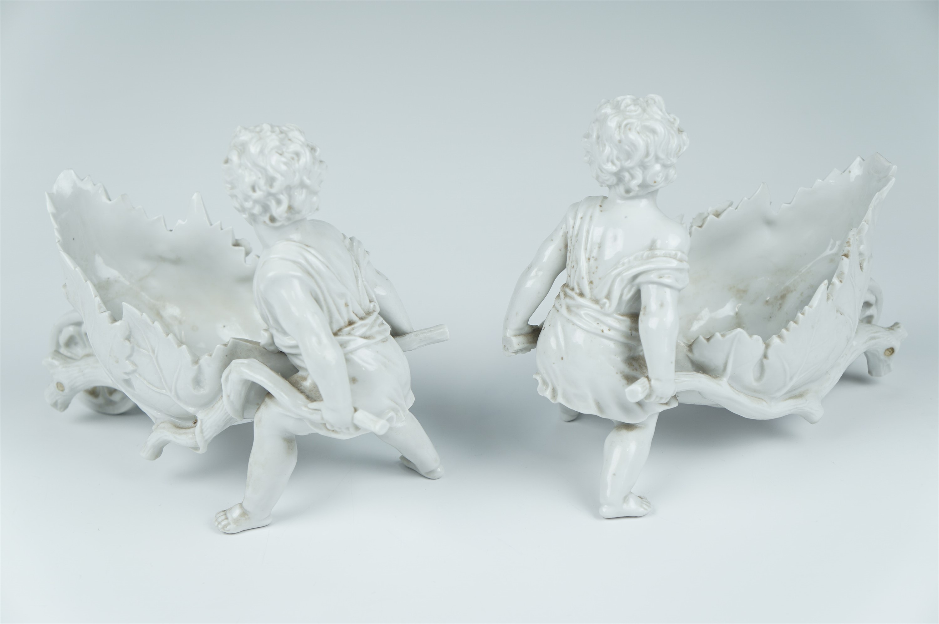 A pair of late 19th Century Volkstedt blanc de chine articulated porcelain figures of putti - Image 3 of 4