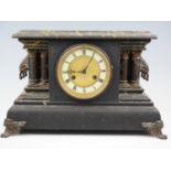 An early 20th Century German faux slate and marble mantle clock, having a Junghans movement,