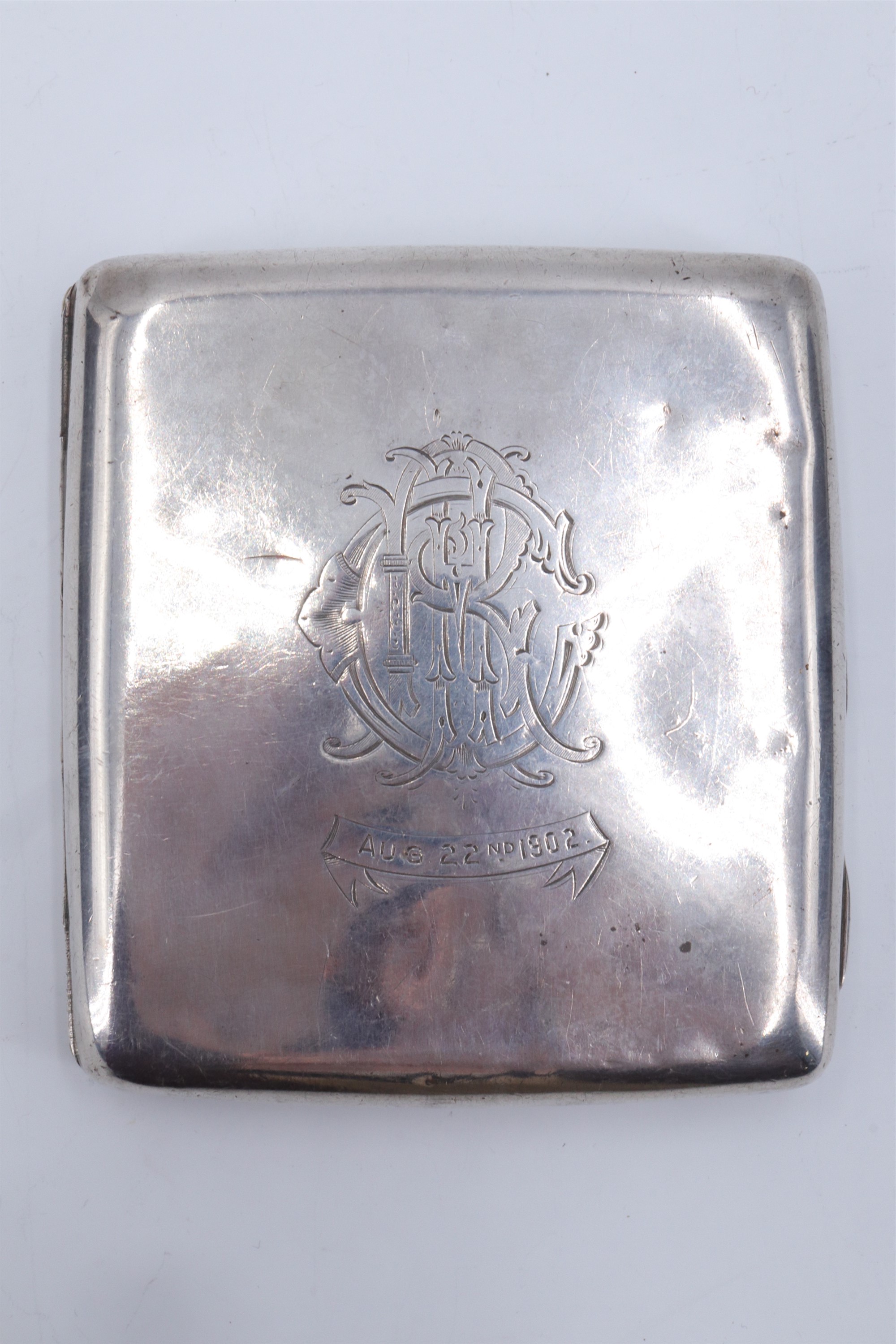 A Victorian silver cigarette case, engraved 'Aug 22nd 1902' surmounted by a monogram, Birmingham,