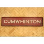 A painted wood Cumwhinton railway station sign, 141 cm x 31 cm. [Provenance: The station closed