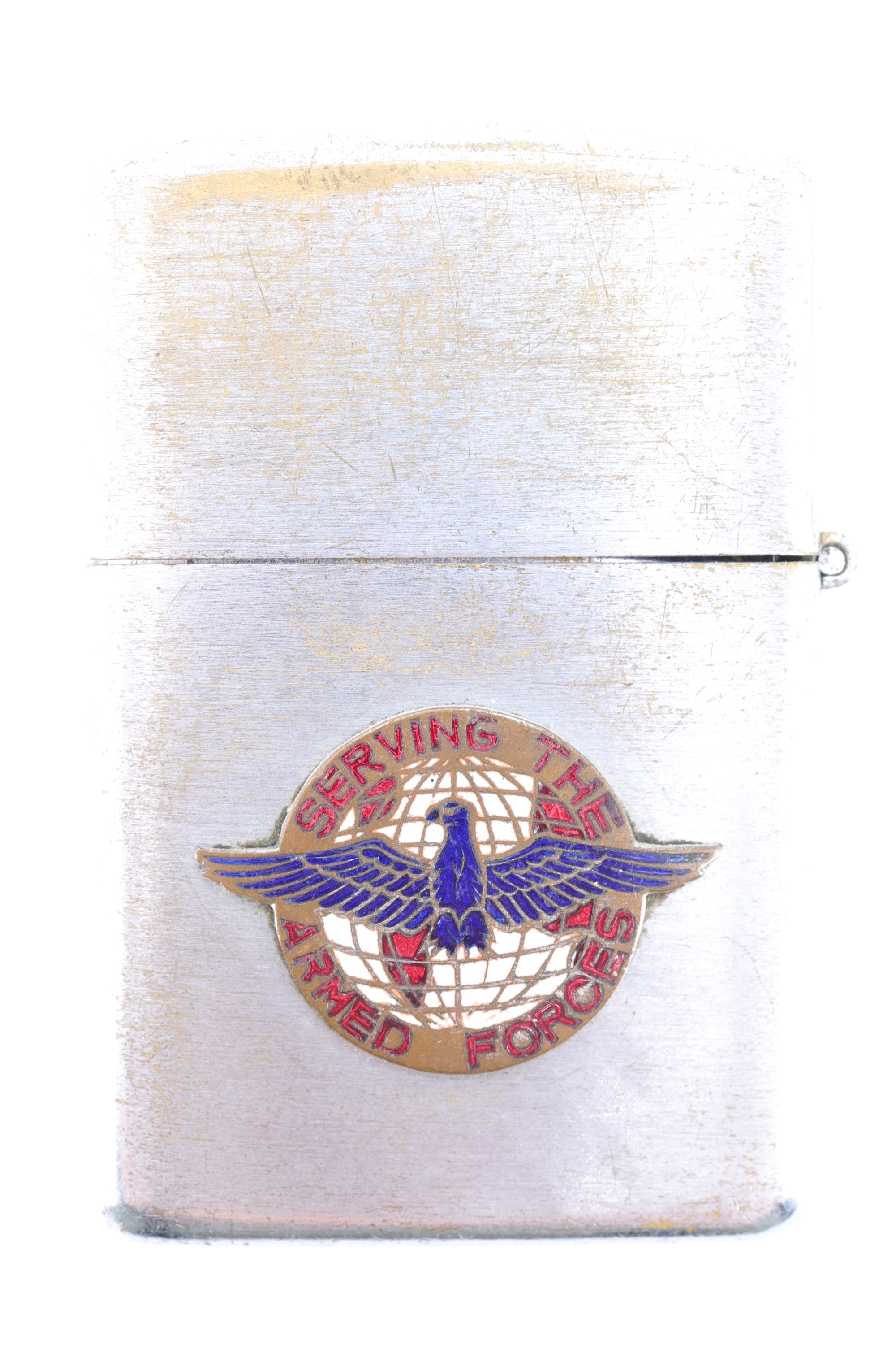 A US "Serving the Armed Forces" Zippo type cigarette lighter by Milserco Inc, a division of Military