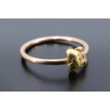 A gold nugget finger ring, the nugget of approx 7 mm x 7 mm set on an 18 ct yellow metal wire shank,