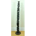 An African carved hardwood standard lamp, three sections, 117 cm