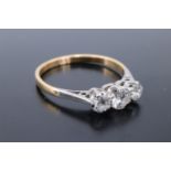 A vintage three-stone diamond ring, the stones of approx 0.6 ct aggregate weight platinum claw set
