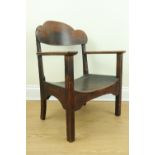 An early 20th Century oak and plywood low armchair, 78 cm