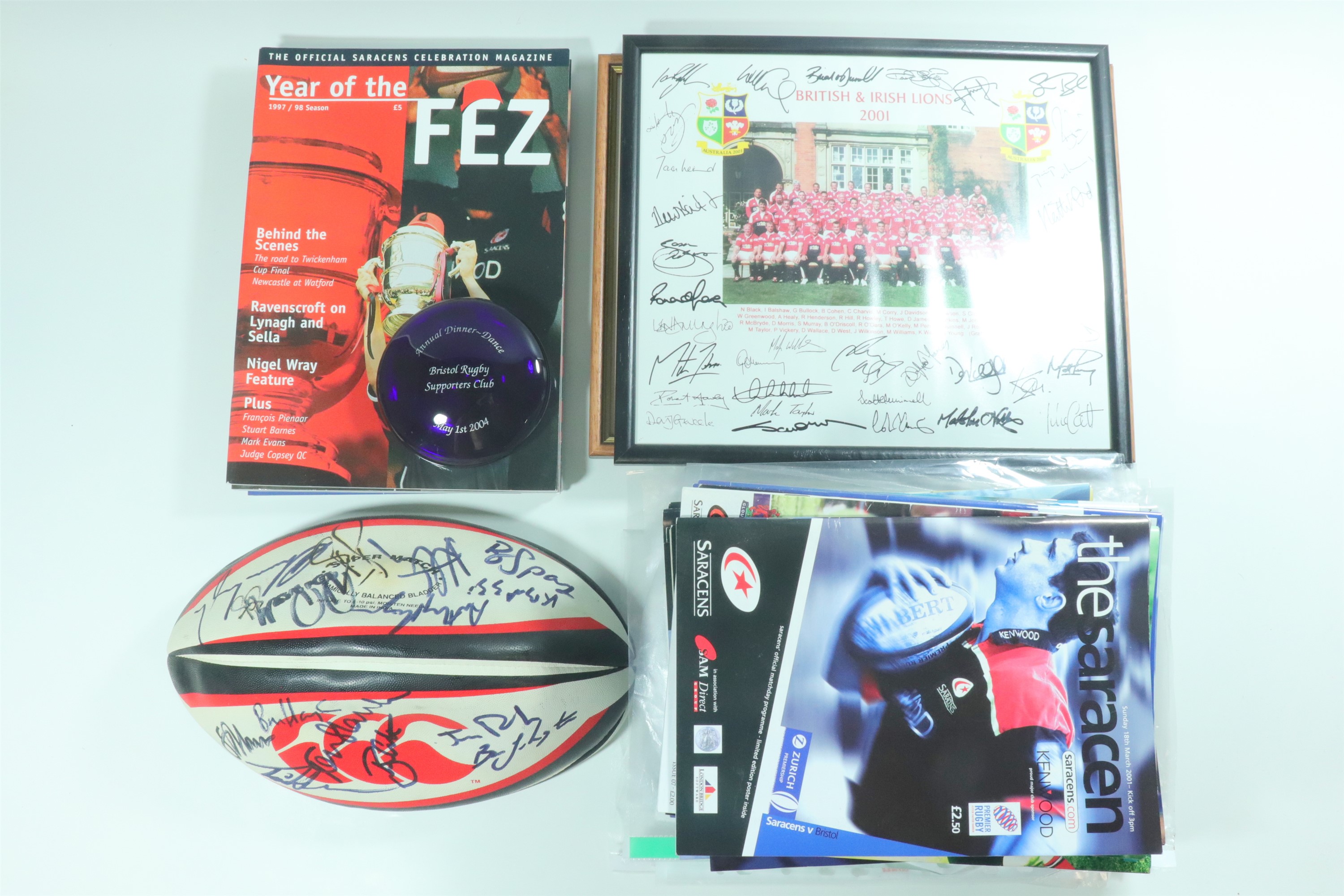 A large quantity of rugby memorabilia, including match day programmes and tickets, signed rugby