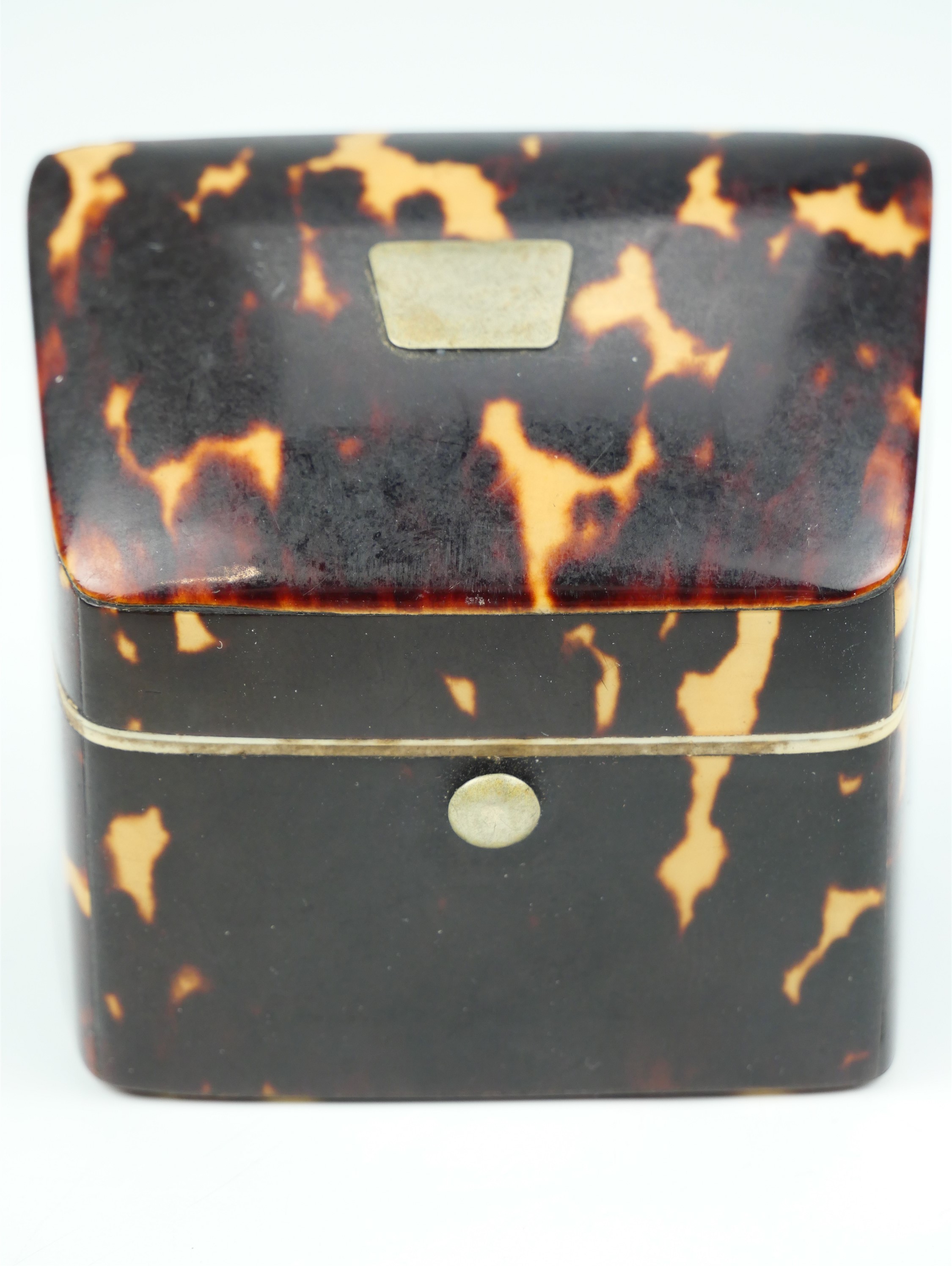 A Victorian tortoiseshell table top needle box by Lund, of trapezoidal form having a vacant