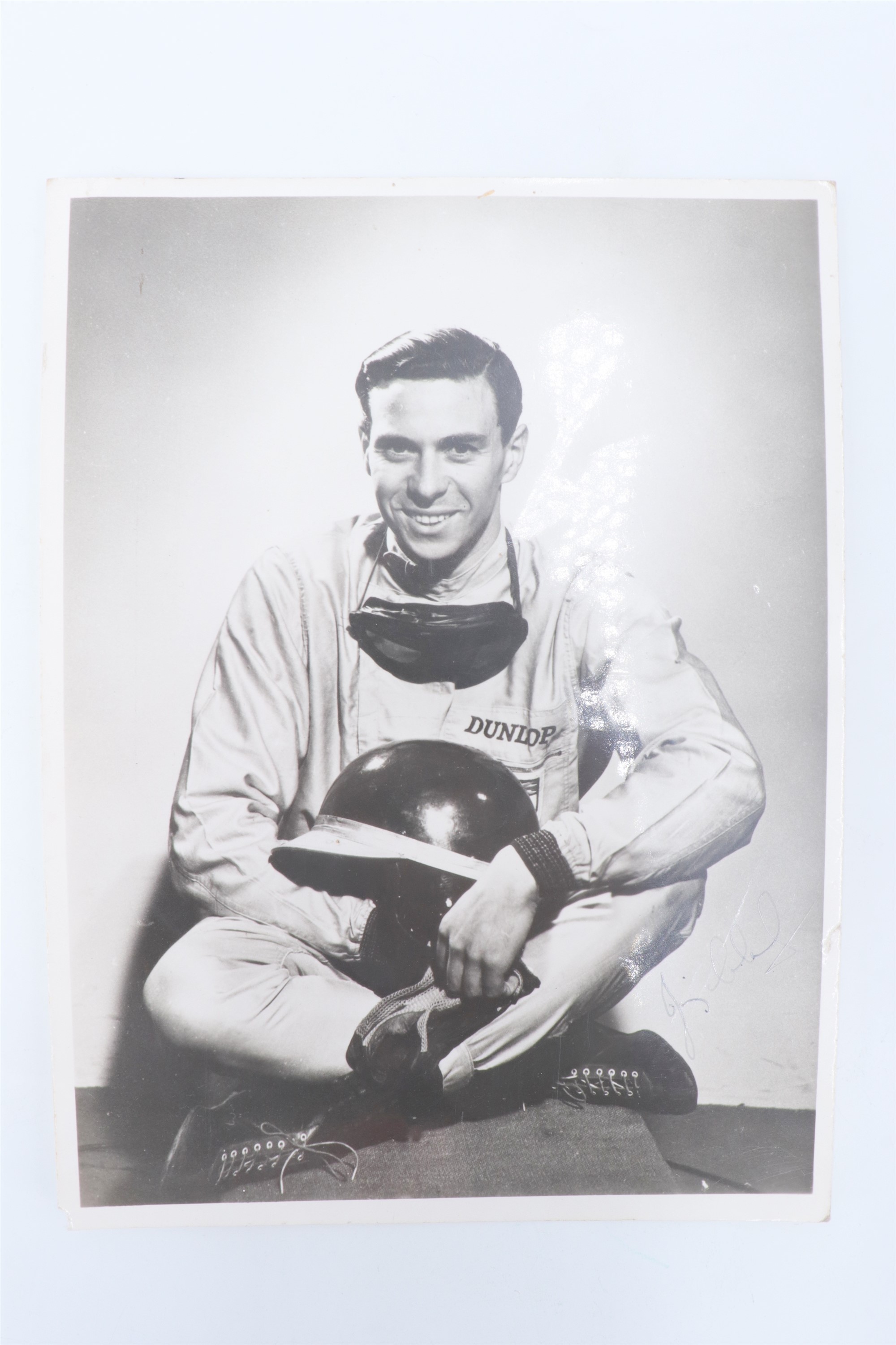 An autographed promotional portrait photograph of racing driver Jim Clarke OBE (1936 - 1968), 8" x