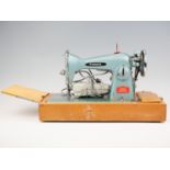 A 1950s Precision De Lux sewing machine