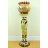 A Victorian earthenware jardiniere and stand, with moulded and hand painted decoration, 112 cm, (a/