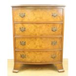 An old reproduction diminutive Georgian style figured walnut bow-fronted chest of drawers, 56 cm x