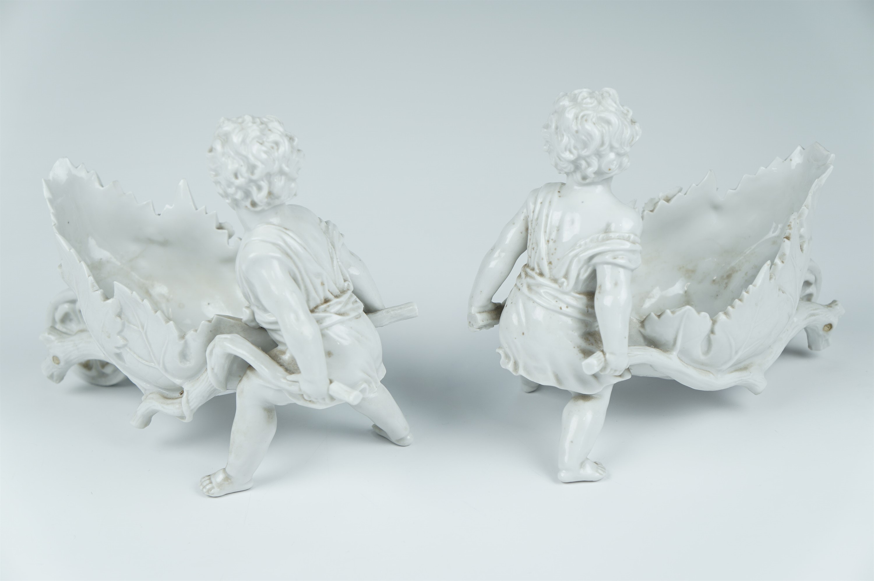 A pair of late 19th Century Volkstedt blanc de chine articulated porcelain figures of putti - Image 4 of 4