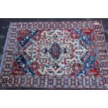Afghan Ziegler type carpet with a medallion and all over stylised design in shades of red, green and