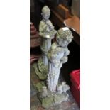 Two 20th Century weathered cast concrete ornamental columns, mounted with figures of a faun and