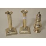 Pair of silver candlesticks of plain design on square plinth bases (weighted), together with a