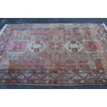 Turkish rug of Caucasian design with repeating polychrome medallions and triple border, 8ft 2ins x
